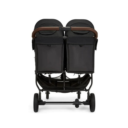 Black double stroller with brown accents on a white background
